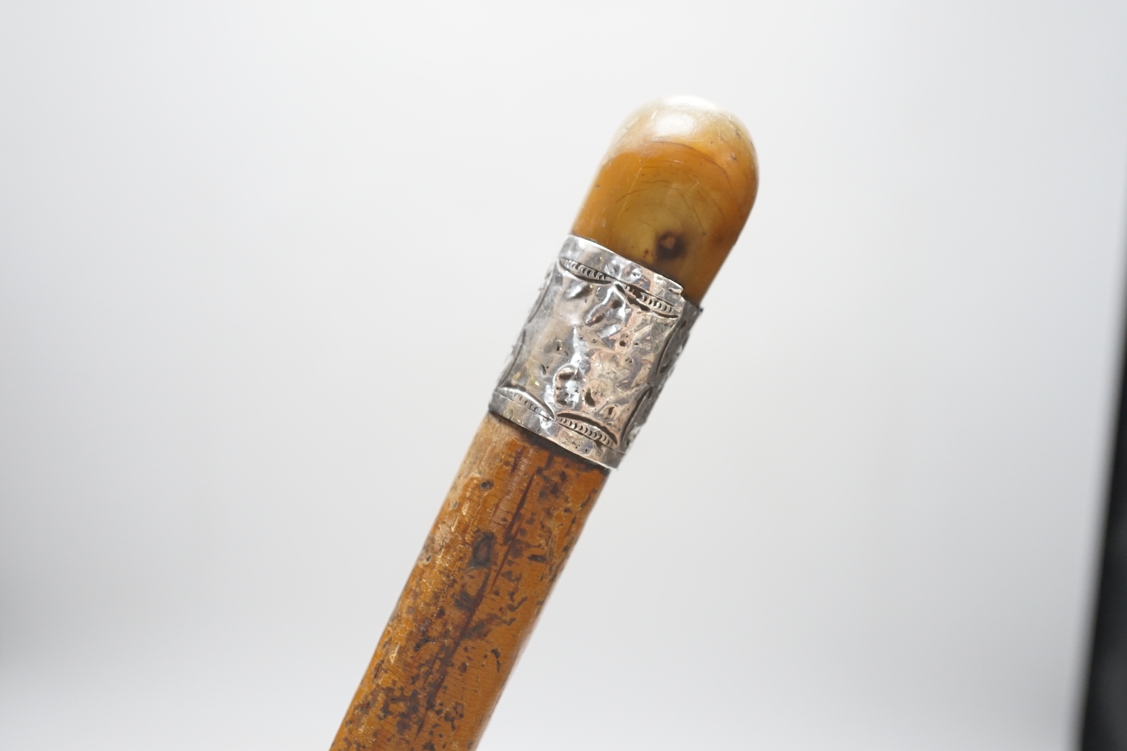 A George V silver and tortoiseshell five piece dressing table set and a silver mounted horn handled malacca walking stick.